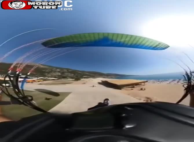Video :This paraglider lands on a walker (and probably breaks his neck)